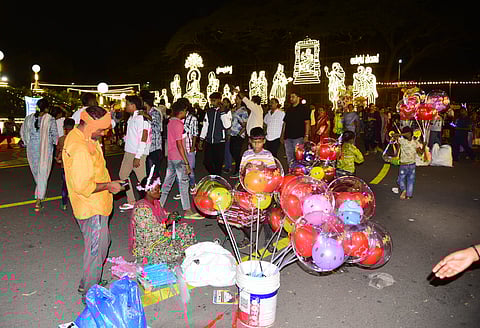 Migrant families selling balloons and toys in Mysuru.