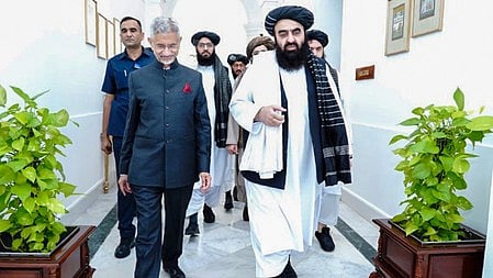 Taliban foreign minister Amir Khan Muttaqi (R) with Indian External Affairs Minister S Jaishankar