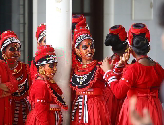 Students share a light moment before their performance