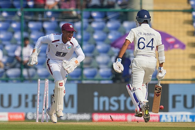 West Indies wicketkeeper Tevin Imlach (L) celebrating the run out of Yashasvi Jaiswal