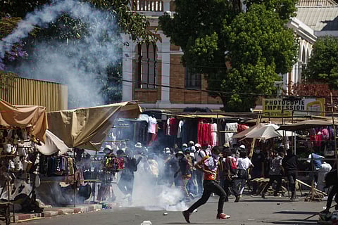Soldiers are greeted by people gathering for a ceremony in tribute to demonstrators killed during recent anti-government protest in Antananarivo, Madagascar, Sunday, Oct. 12, 2025.