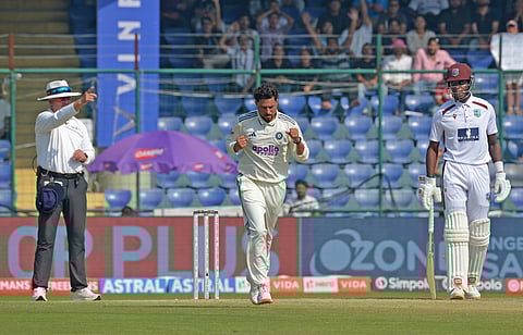 Kuldeep Yadav celebrates a wicket with teammate B Sai Sudharsan on Day 4 of the second Test on Monday in New Delhi