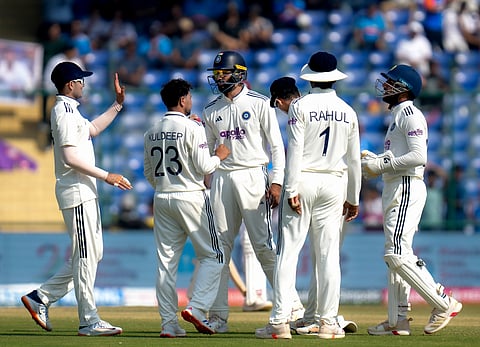 India's Kuldeep Yadav celebrates with teammates after taking the wicket of West Indies' Tevin Imlach on day three of the second and final Test cricket match of a series between India and West Indies, in New Delhi, Sunday, Oct. 11, 2025. 