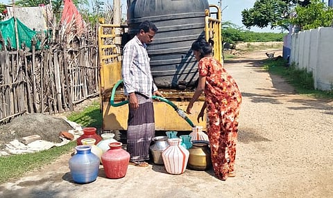 Residents of Chandirapadi in Mayiladuthurai collect water from a private supplier  who arrives in the village two times a week for Rs 10 per plastic pot 