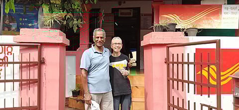 Haim Aharon pose for a photograph  with his wife Noga outside the Mala Post Office, which was once his home. Picture is from his last visit to Kerala; in December 2022