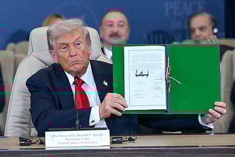 Flanked by President Donald Trump, Pakistan Prime Minister Shehbaz Sharif speaks during the Gaza International Peace Summit in Sharm el-Sheikh, Egypt, Monday, Oct. 13, 2025.