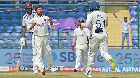 Kuldeep Yadav celebrates a wicket with teammate B Sai Sudharsan on Day 4 of the second Test on Monday in New Delhi