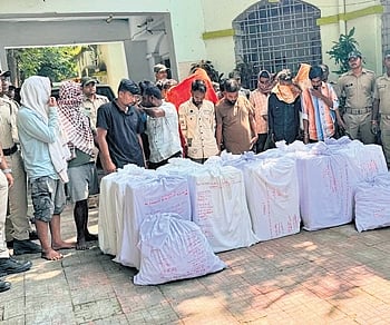 The accused with the seized cough syrup