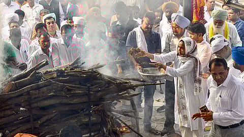 Family members of Haryana IPS officer Y Puran Kumar, who allegedly shot himself dead, perform his last rites at the Sector 25 cremation ground, in Chandigarh, Wednesday, Oct. 15, 2025