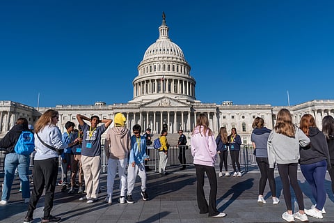 With the government shutdown now in its third week, a sign turns away tourists at the entrance to the Capitol Visitor Center in Washington, Wednesday, Oct. 15, 2025.