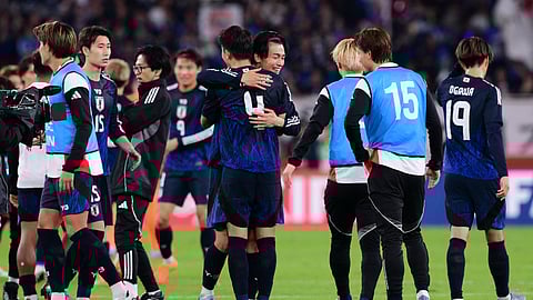 Japan's players celebrate their victory after the international football friendly match between Japan and Brazil at the Tokyo stadium in Chofu, Tokyo prefecture on October 14, 2025.