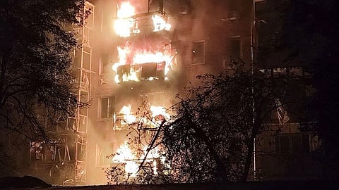 In this photo provided by the Ukrainian Emergency Services on Thursday, Oct. 16, 2025, a residential building is seen on fire after a Russian strike in Nizhyn, Chernihiv region, Ukraine.