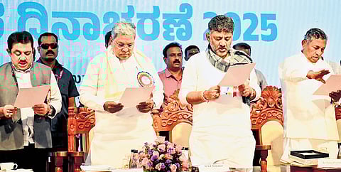 Chief Minister Siddaramaiah, DCM DK Shivakumar, and ministers KH Muniyappa and  BZ Zameer Ahmed Khan take a pledge against wasting food on the occasion of World Food Day in Vidhana Soudha in Bengaluru on Thursday 