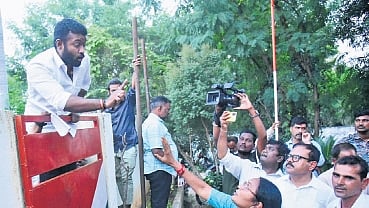 A Congress worker argues with TPCC vice-president Atram Suguna at the party office in Karimnagar on Thursday