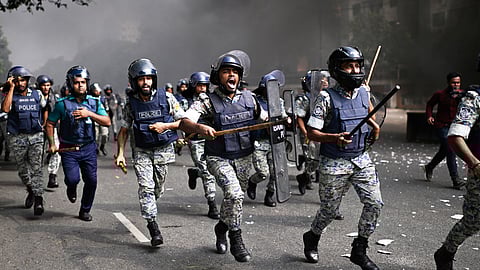 Police disperse protesters outside Bangladesh's national parliament complex in Dhaka, Bangladesh, Friday, Oct. 17, 2025