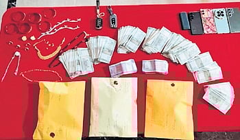 Police arrested three persons and seized 555 gm brown sugar from them