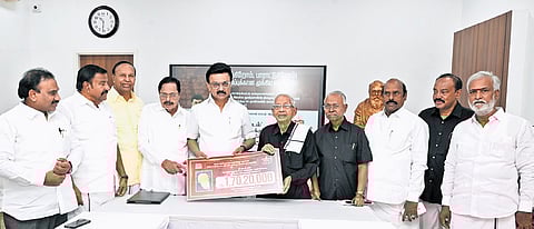 CM Stalin handing over a cheque for Rs 1.7 crore to DK president K Veeramani.