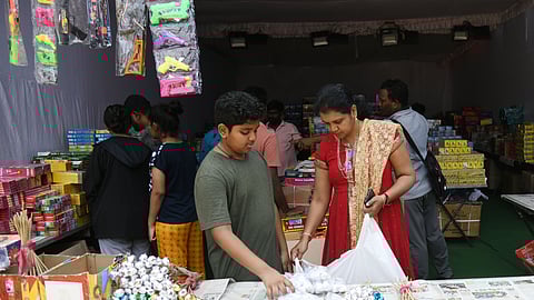 People buy firecrackers ahead of the Diwali festival in Hyderabad.