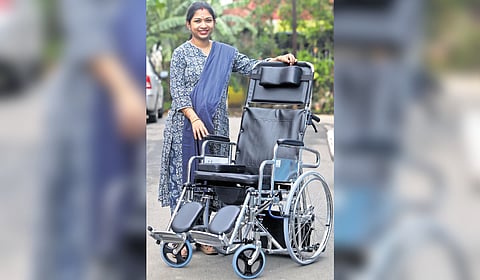 Biomedical engineer Sruthi Babu with the wheelchair.