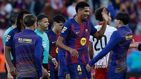 Barcelona players celebrate after a La Liga soccer match between Barcelona and Girona in Barcelona, Spain, Saturday, Oct. 18, 2025. 