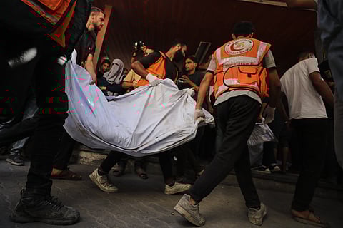 The bodies of Palestinians, killed by Israeli fire, are brought to the Al Ahli Hospital in Gaza City, Saturday, October 18, 2025. 
