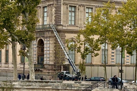 Visitors queue to enter the Louvre museum three days after historic jewels were stolen in a daring daylight heist, Wednesday, Oct. 22, 2025 in Paris.