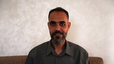 Palestinian medical technician Mohammed Abu Moussa, 45, who was released from Israeli detention after 20 months, poses for a photo in Deir al-Balah, Gaza, Saturday, Oct, 18, 2025.