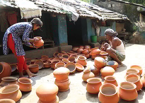 Potters of Kummari Veedhi in Madagada village of Alluri Sitarama Raju making mud clay articles ahead of Deepavali festival.