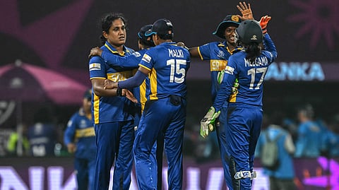 Sri Lanka's captain Chamari Athapaththu (L) and her teammates celebrate after their team's win in the ICC Women's Cricket World Cup 2025 one-day international (ODI) match between Sri Lanka and Bangladesh at the DY Patil Stadium in Navi Mumbai on October 20, 2025. 