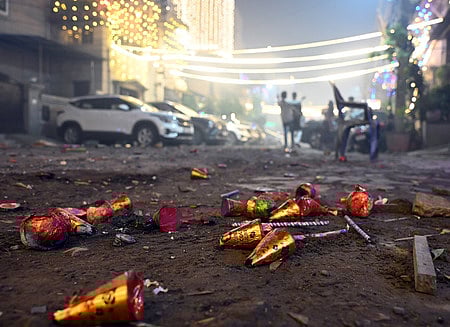 People burst fire crackers on the occasion of Diwali in Chennai on Monday.