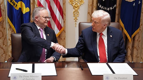 US President Donald Trump (R) shakes the hand of Australian Prime Minister Anthony Albanese during a meeting in the Cabinet Room of the White House, Monday, October 20, 2025, in Washington.