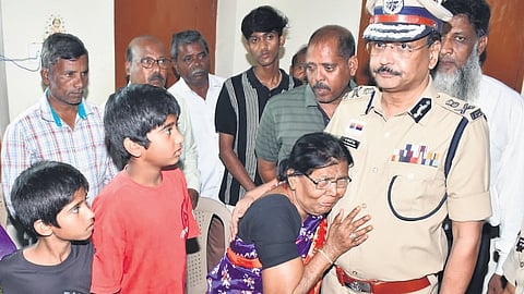 DGP B Shivadhar Reddy, along with other police officials, meets the family members of slain CCS constable M Pramod Kumar in Nizamabad on Tuesday.