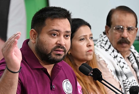 RJD leader and Leader of Opposition in Bihar Assembly Tejashwi Yadav addresses INDIA bloc press conference, in Patna, Thursday, Oct. 23, 2025. Congress leader Ashok Gehlot is also seen.