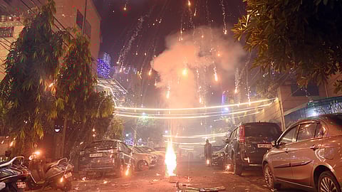 People burst fire crackers on the occasion of Diwali in Delhi NCR on Monday .