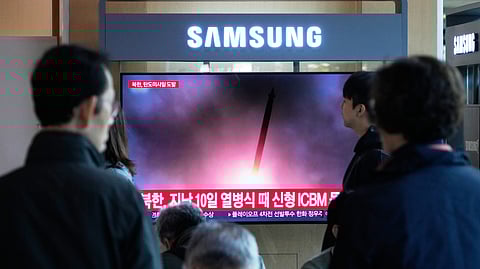 A TV screen shows a file image of North Korea's missile launch during a news program at Seoul Railway Station in Seoul, South Korea, Wednesday, Oct. 22, 2025