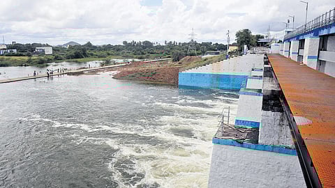 Shutters of Chembarambakkam reservoir opened to facilitate controlled release of surplus water on Wednesday.