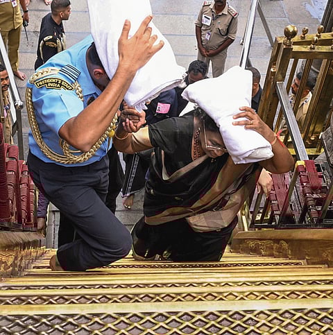 President Droupadi Murmu offering prayers at the sreekovil of the Sabarimala temple on Wednesday.