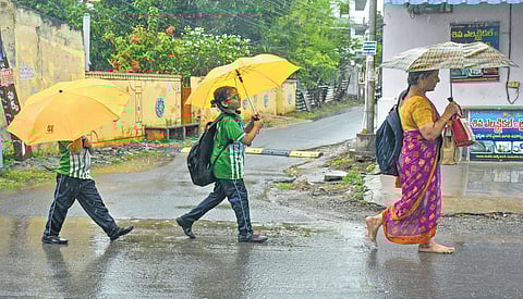 Citizens witness sudden downpour at the beginning of dusk in Vijayawada on Wednesday.