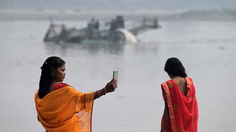 A women  taking selfie near Yamuna river in New Delhi 