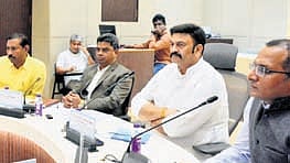 Deputy Speaker K Raghu Rama Krishna Raju reviews health and food safety with officials in Vizag.