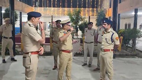 Haryana Director General of Police O P Singh talking to police personnel during the night patrol.