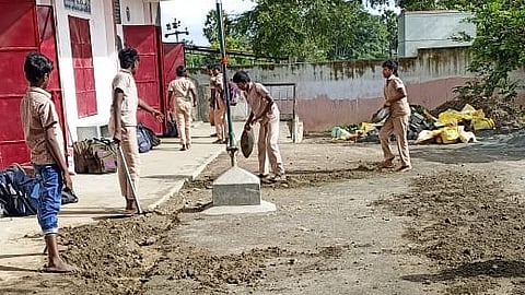 The students allegedly worked for over an hour, and a passerby recorded the video, which has now been shared on social media.