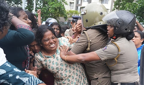 In retaliation, demonstrators blocked a police jeep and staged a sit-in, leading to the arrest and removal of several participants.