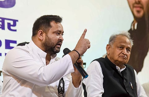 RJD leader and Leader of Opposition in Bihar Assembly Tejashwi Yadav addresses INDIA bloc press conference, in Patna, Thursday, Oct. 23, 2025. Congress leader Ashok Gehlot is also seen.