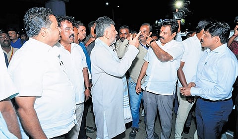 Deputy Chief Minister DK Shivakumar gets a briefing from officials during his inspection in Bengaluru South City Corporation limits on Thursday 