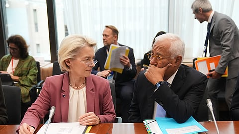 European Commission President Ursula von der Leyen, left, and European Council President Antonio Costa wait for the start of the Tripartite Social Summit at the European Council building in Brussels, Wednesday, Oct. 22, 2025.