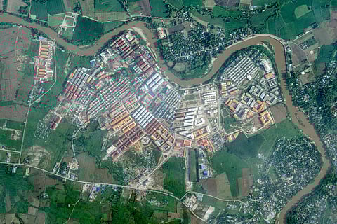 The KK Park complex in Myanmar's eastern Myawaddy township along the Moei River facing Mae Sot district (top and R) in Thailand's border province of Tak, Sept. 18, 2025.