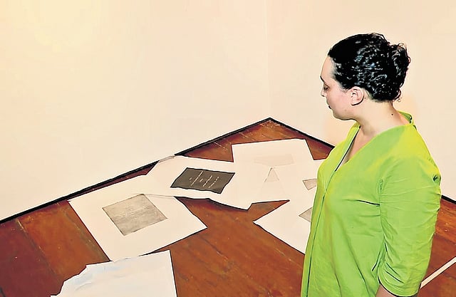 Hanan Benammar near her vandalised artwork
