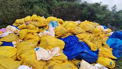A large number of garbage bags were found on a vacant land along the Dharapuram-Erode state highway near Siru Kinar village in Kundadam Union in Tiruppur district on Tuesday morning