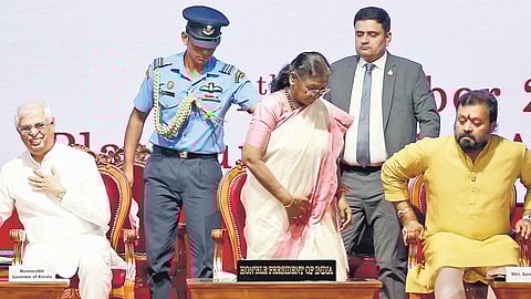President Droupadi Murmu moves to the podium to speak at the centenary celebration of St Teresa’s College in Kochi on Friday. 